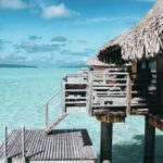 Luxury Travel - Brown Nipa Hut on Body of Water