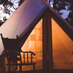 Glamping - White and Brown Lighted Cabin Tent at Woods