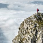 Altitude - Photography of Person on Green Mountain