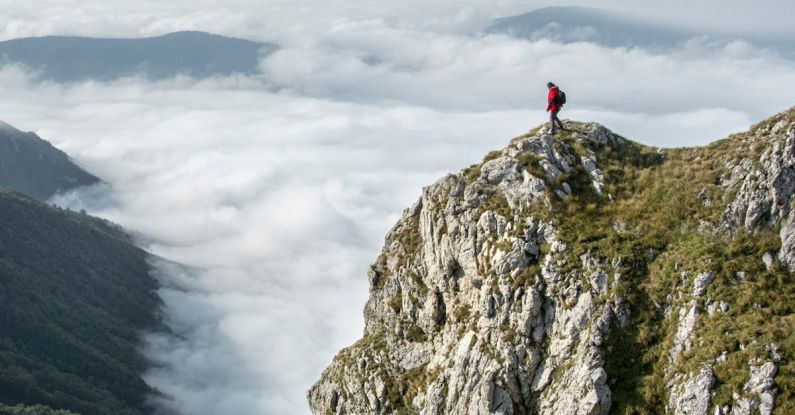 Altitude - Photography of Person on Green Mountain