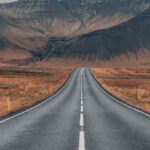 Adventure - Empty Highway Overlooking Mountain Under Dark Skies