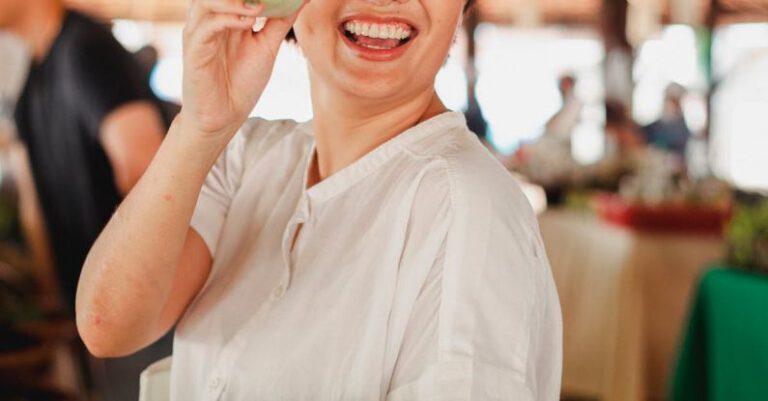 Local Economies - Happy ethnic woman with salad leaf