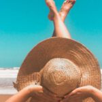 Vacations - Person Laying On Sand