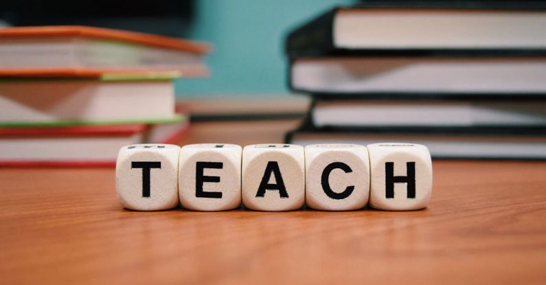 Educate - Teach Dice Ornament on Table