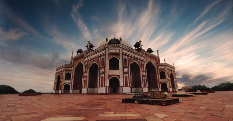 Heritage - Brown and Black Mosque Under White and Blue Cloudy Sky