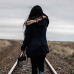 Solo Road Trips - Woman Walking in Middle of Railway