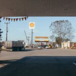 Fuel Costs - Empty gas station with oil petrol dispensers located on highway for serving long distance vehicles