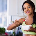 Eat Healthy - Woman Holding Gray Steel Spoon
