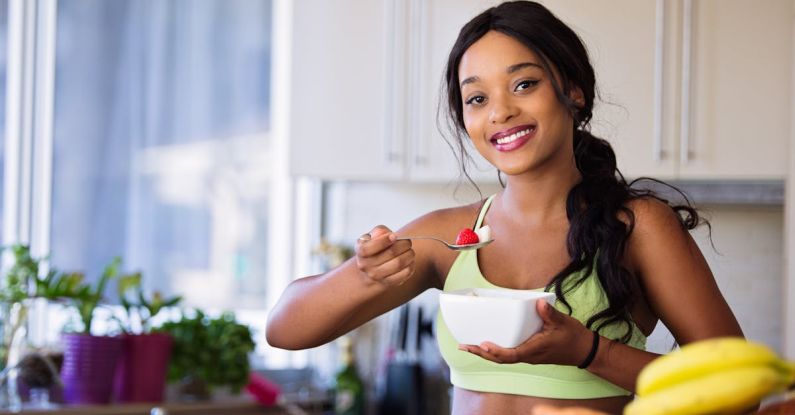 Eat Healthy - Woman Holding Gray Steel Spoon